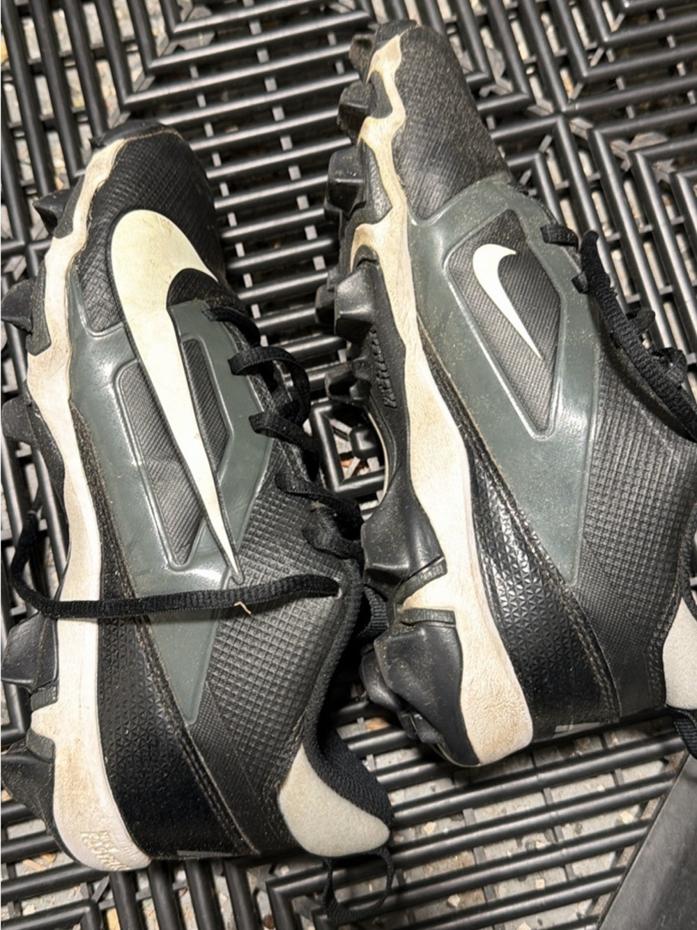 Nike boys Black Cleats with White Swoosh